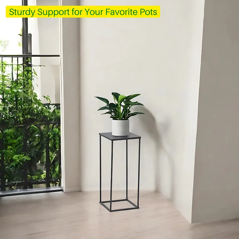 Black planter stand with a potted plant near a bright balcony doorway.