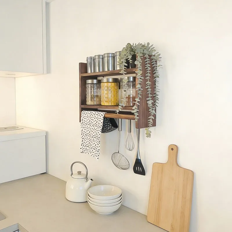 Angled view of the wall-mounted kitchen rack in a bright kitchen
