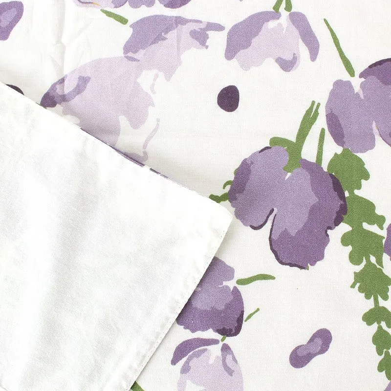 Close-up showing the floral print and matte textile surface