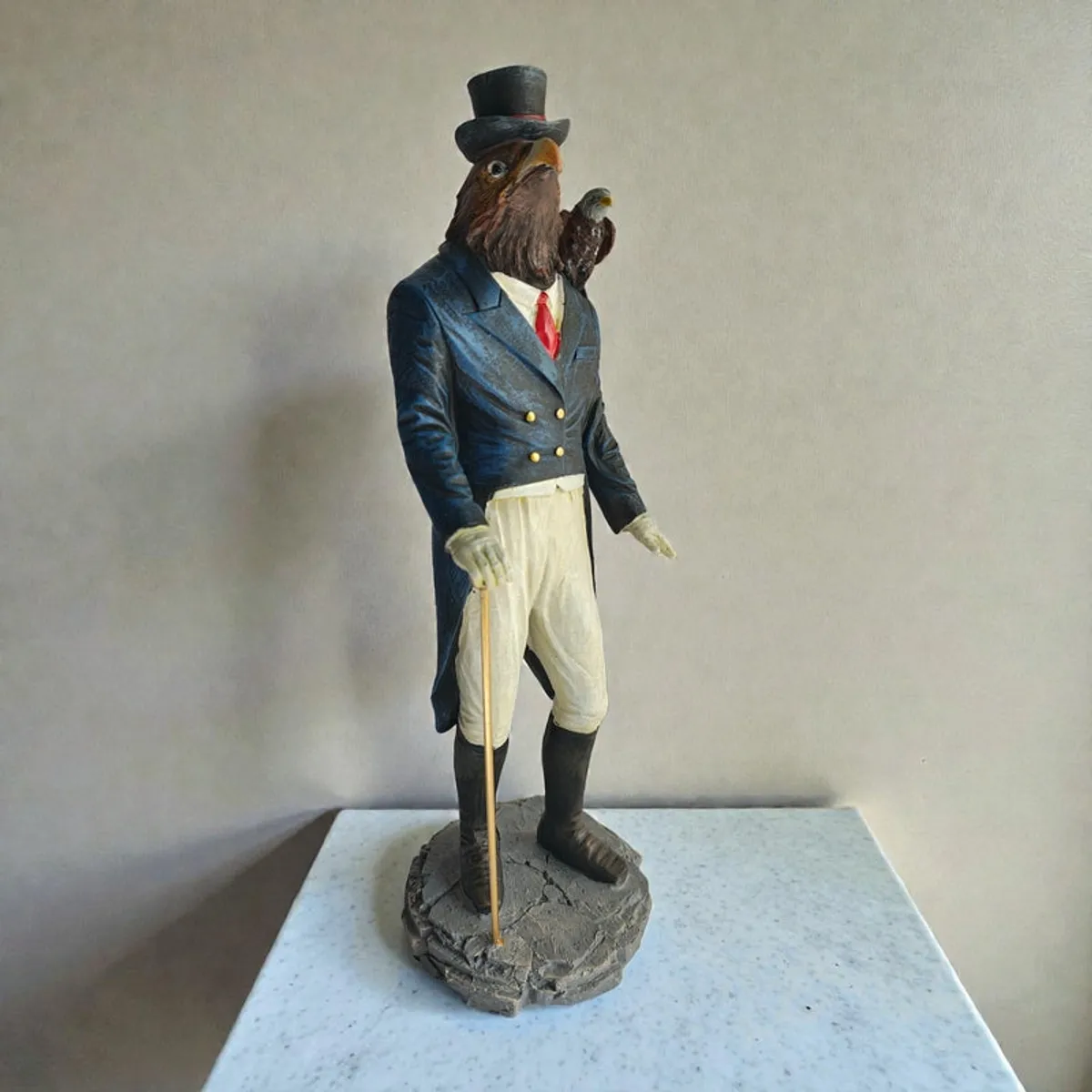 Angled view of the rooster gentleman showpiece on a light pedestal