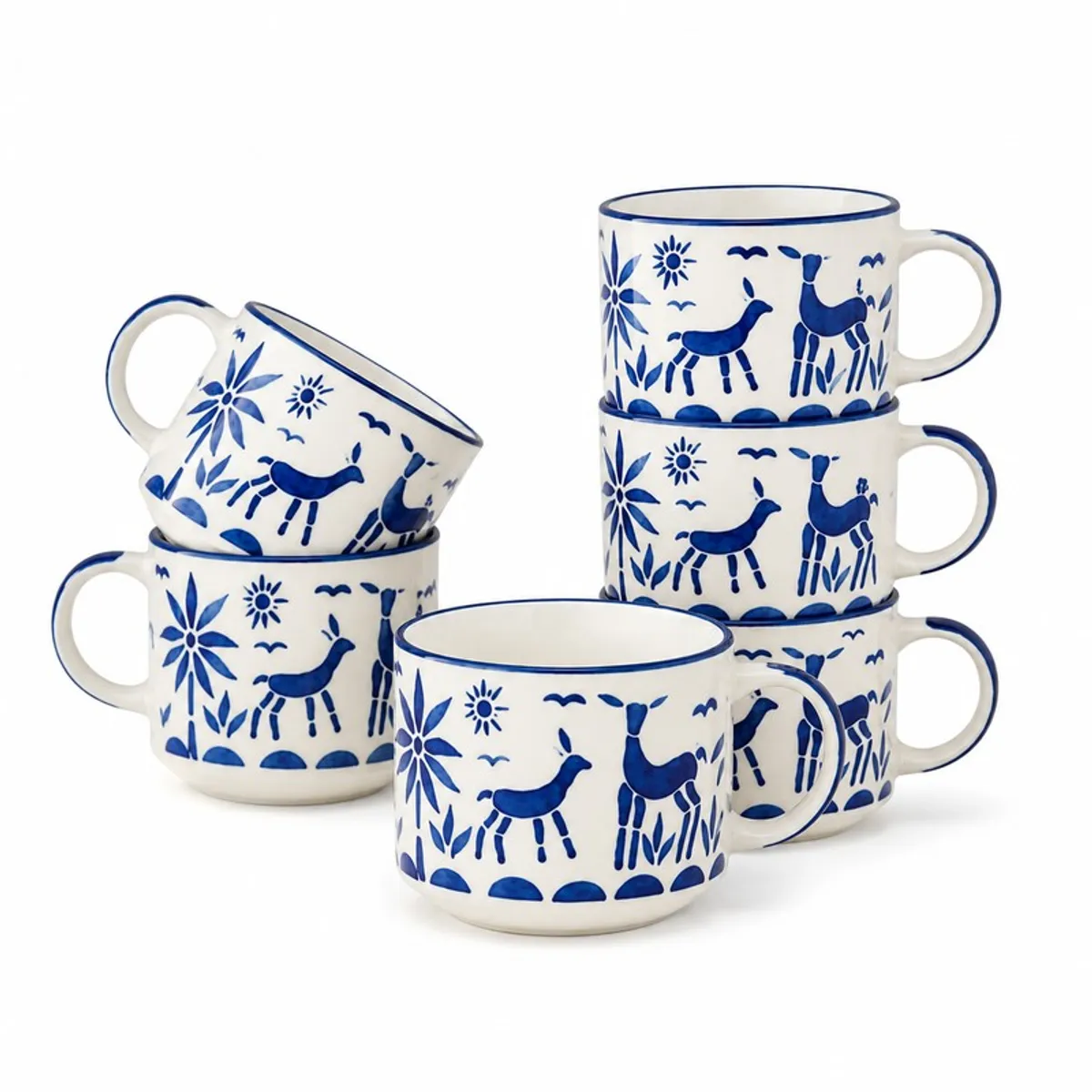 Six blue-and-white reindeer motif ceramic cups arranged against a white background.