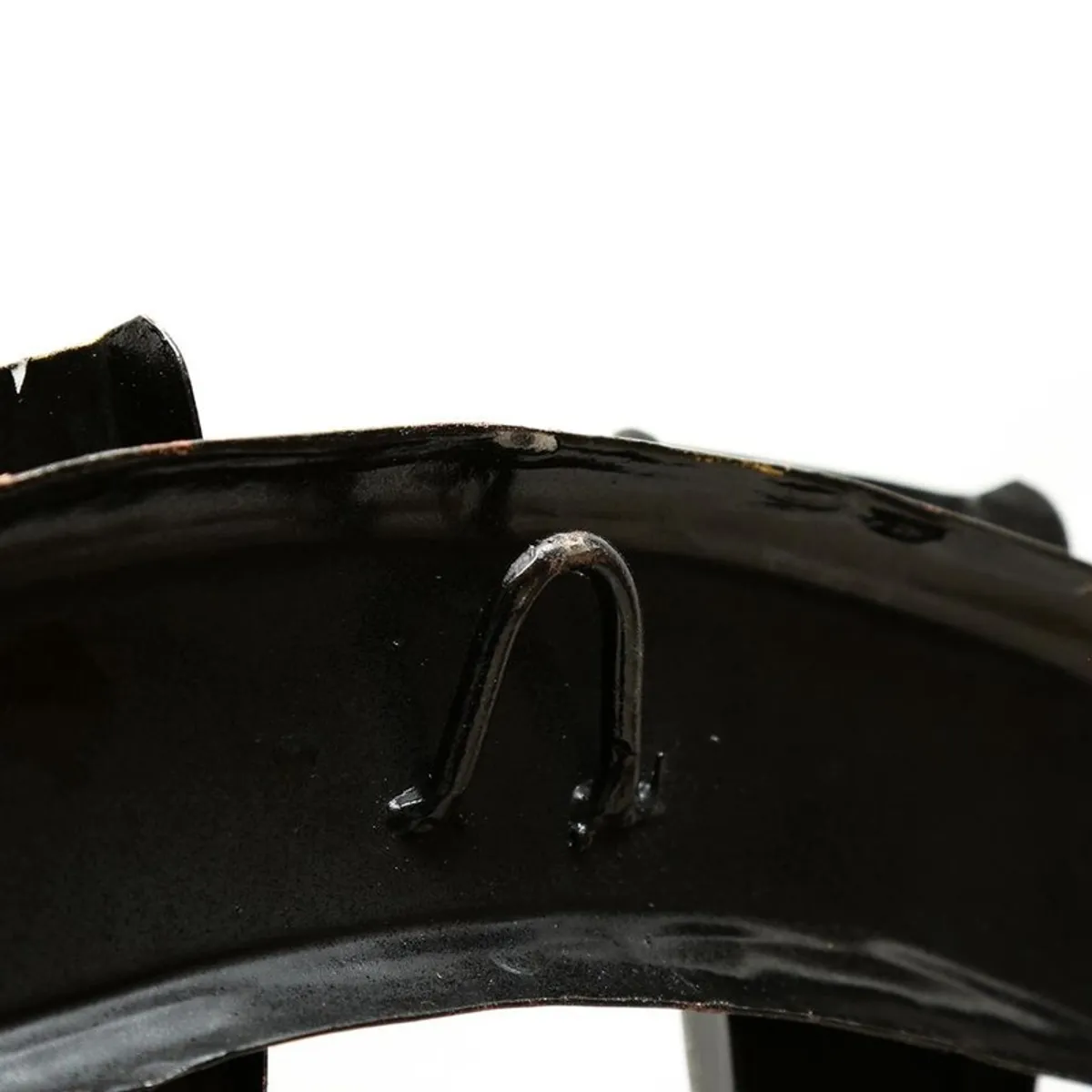 Close-up of the rear hanging hook on the metal wall accent