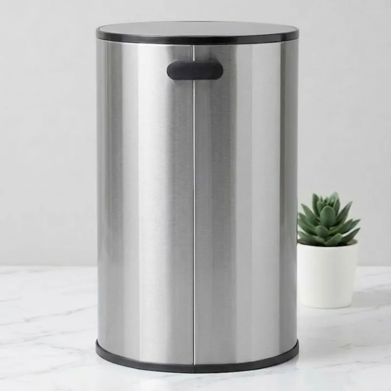 Rear view of a silver cylindrical metal dustbin
