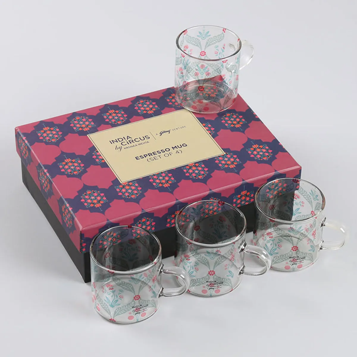 Four transparent floral glass mugs with a decorative gift box