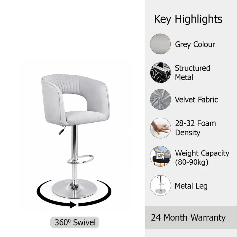 Grey velvet bar chair with chrome base and curved back on white background