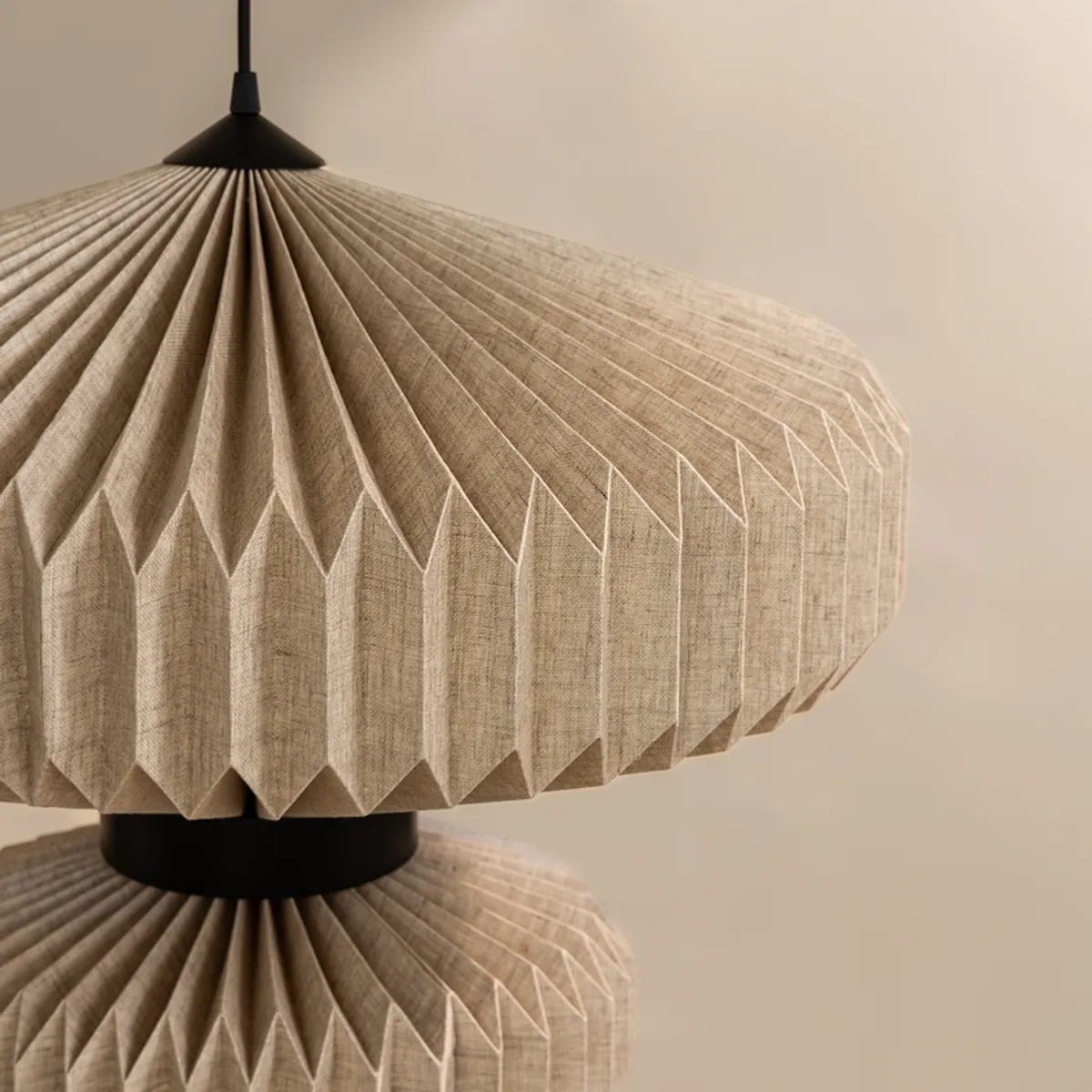 Close-up of pleated beige shade and black central band