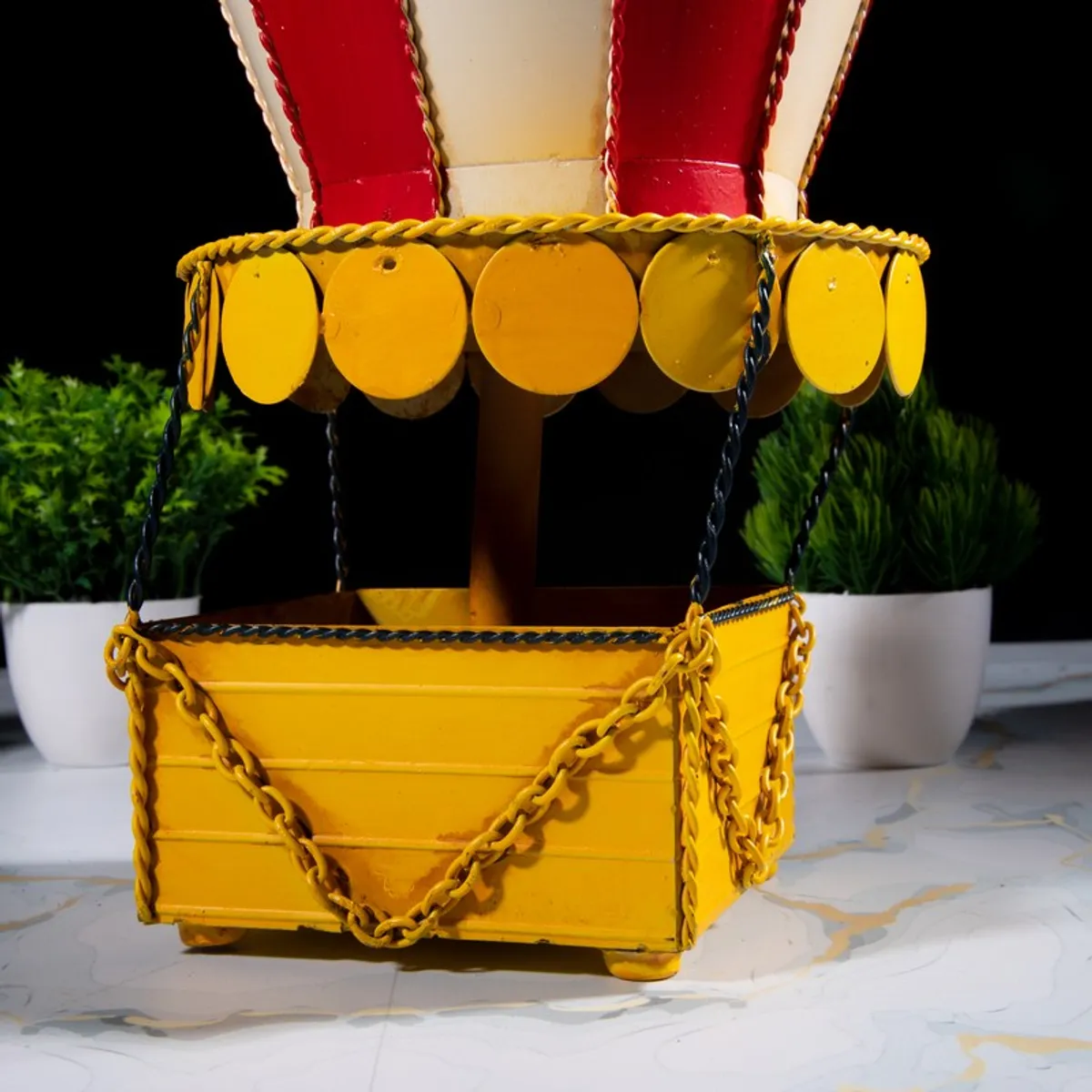 Close-up of yellow basket base of the hot air balloon showpiece