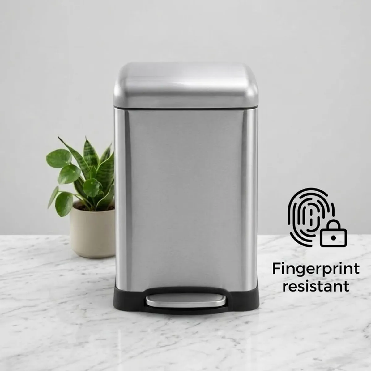 Front view of silver pedal dustbin on a marble surface
