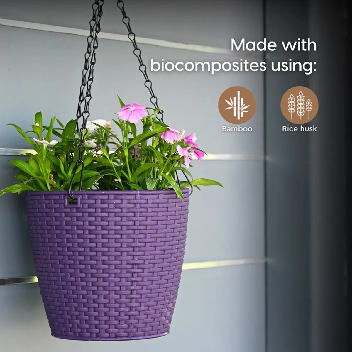 Close-up of a purple hanging planter with chain suspension