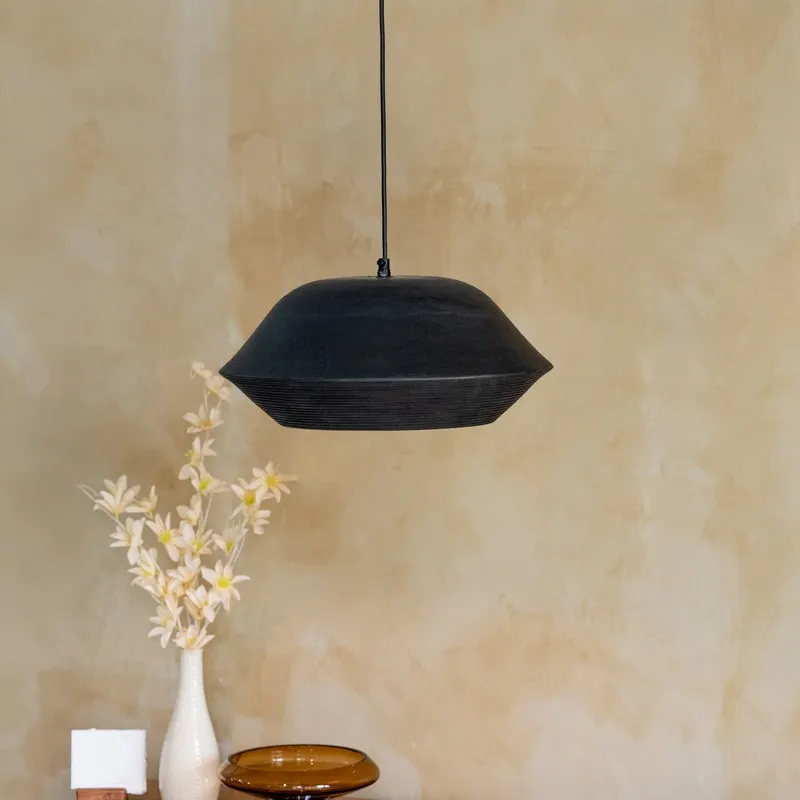 Black pendant ceiling lamp with a broad sculptural shade