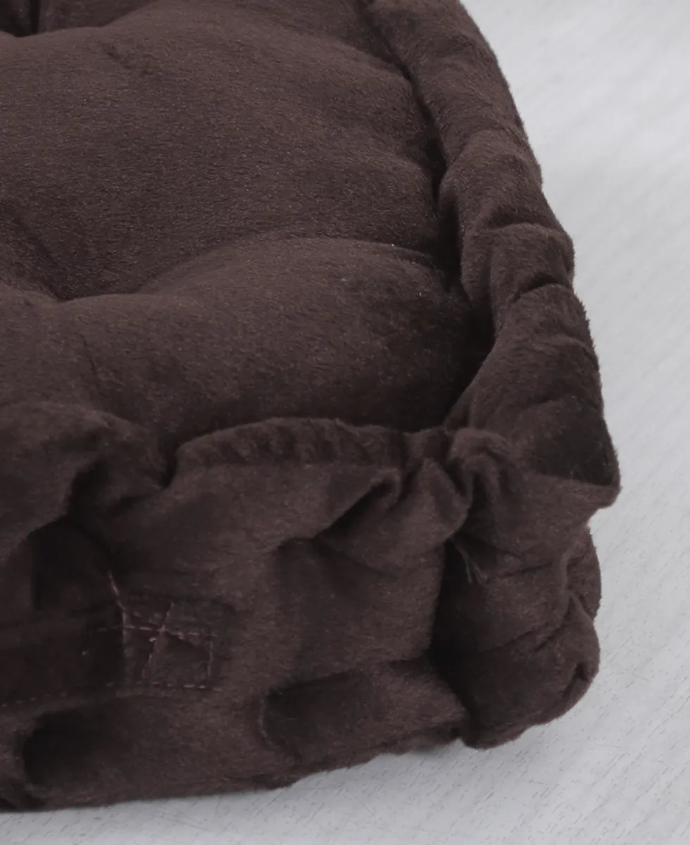Close-up of the brown velvet cushion edge and soft surface