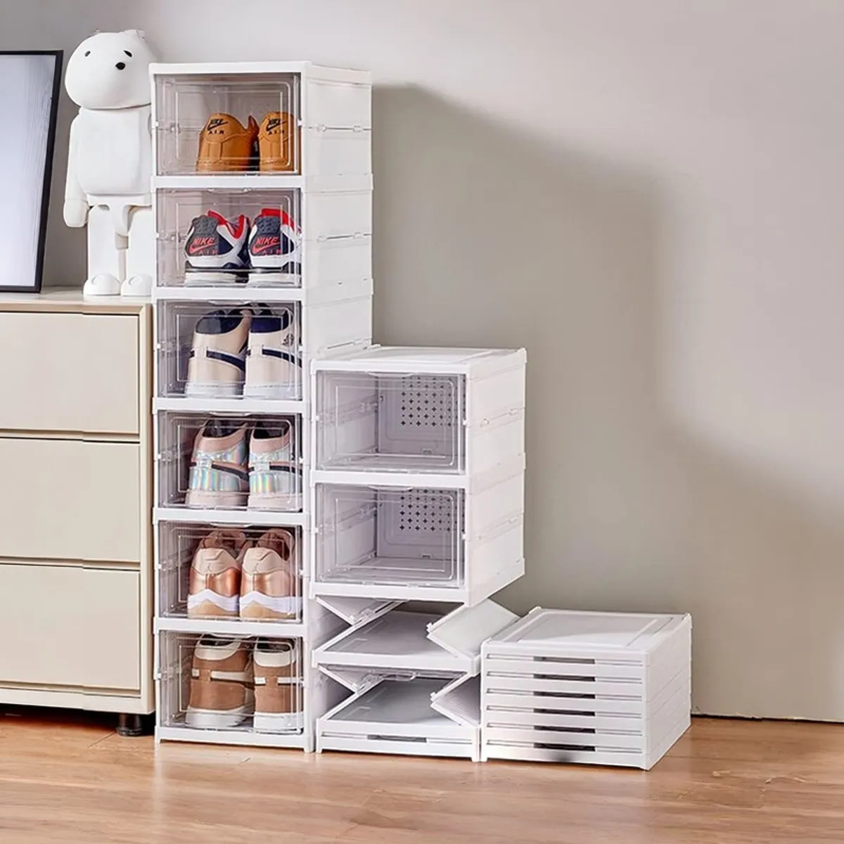 White shoe rack displayed with footwear and additional folded rack sections