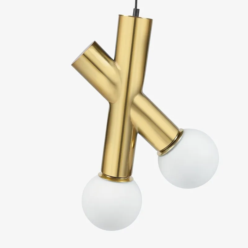 Close-up of gold crossbar lamp body with two white globe shades