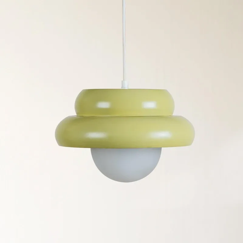 Front view of pistachio green round ceiling lamp with white globe shade