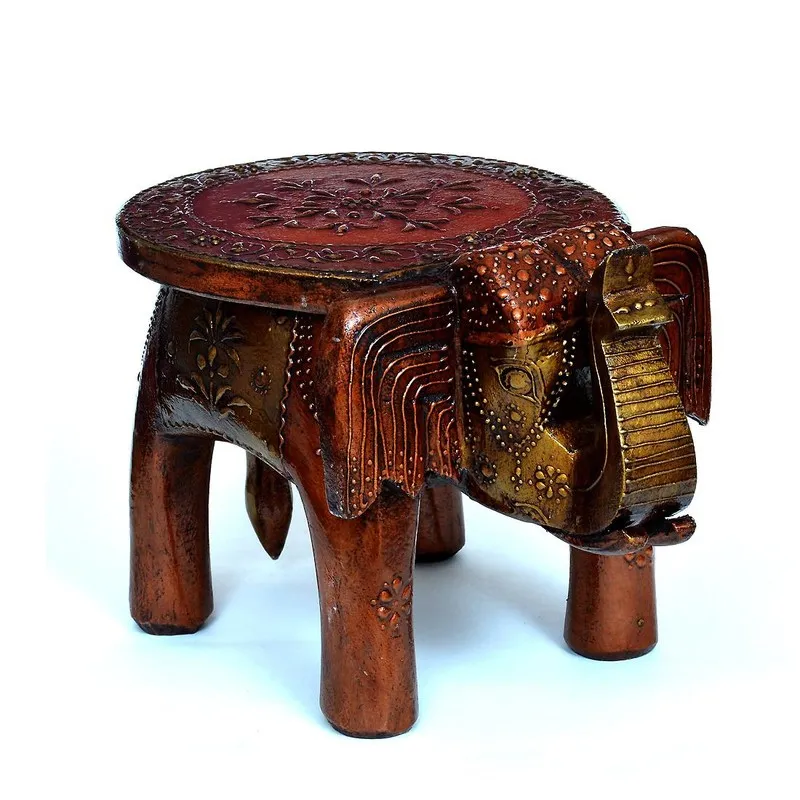 Angled view of brown carved wooden stool with detailed base