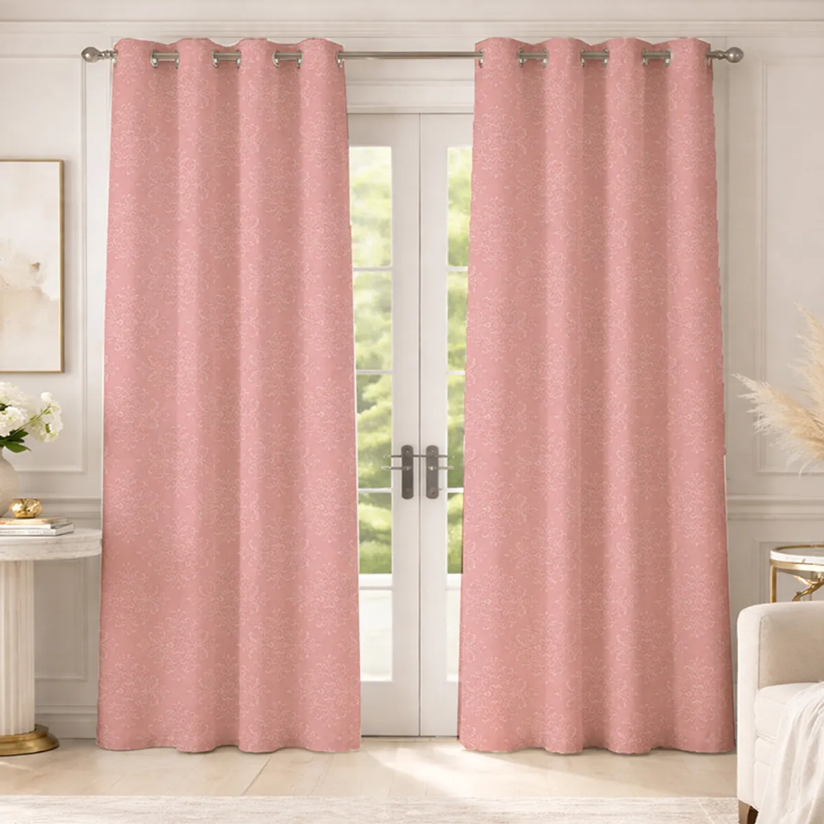 Set of two pink eyelet curtains with white damask-style pattern on a doorway