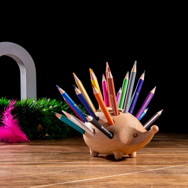 Hedgehog-shaped wooden pencil organiser filled with coloured pencils