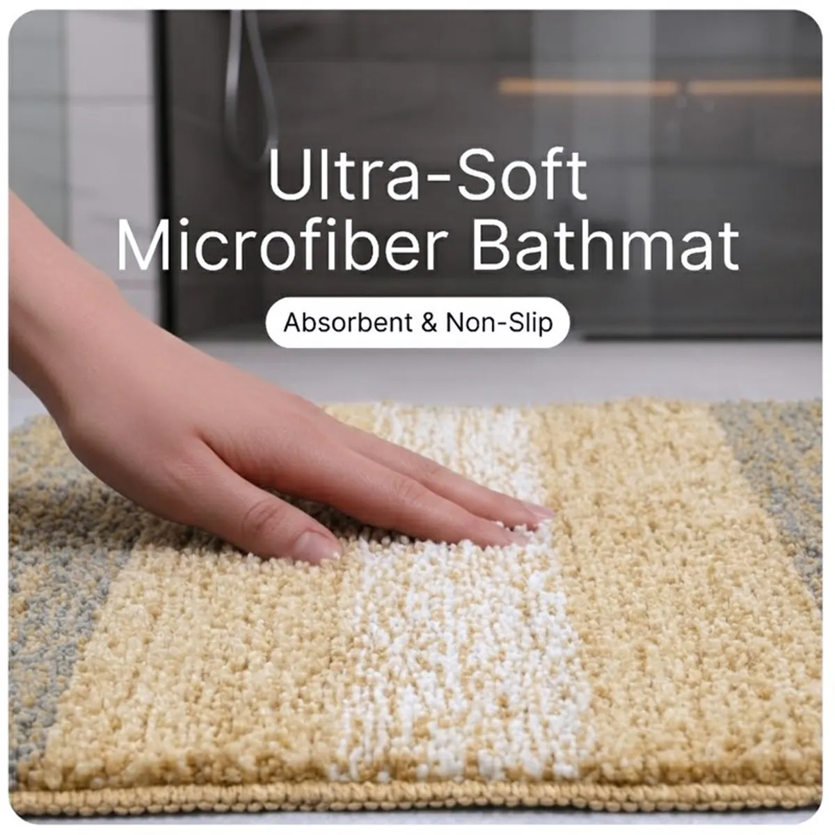 Close-up view of the soft textured beige and grey striped bath mat surface.