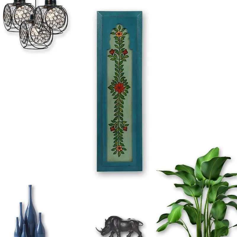 Blue wall-mounted accent with painted botanical motif shown on a styled wall