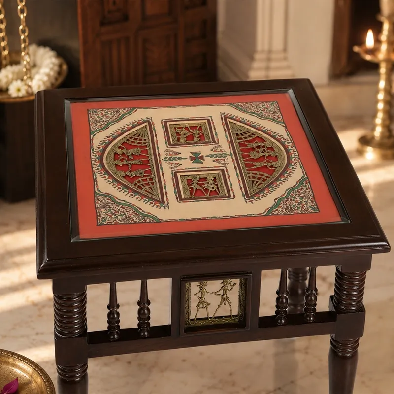 Close view of the table top with traditional figurative artwork under glass