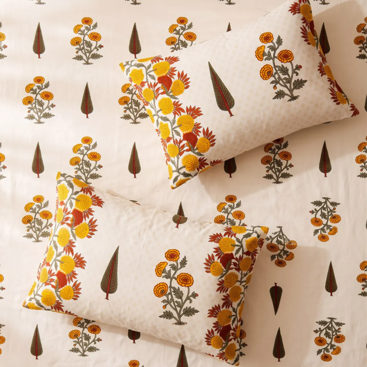 Flat lay showing floral bedsheet pattern with matching pillow covers