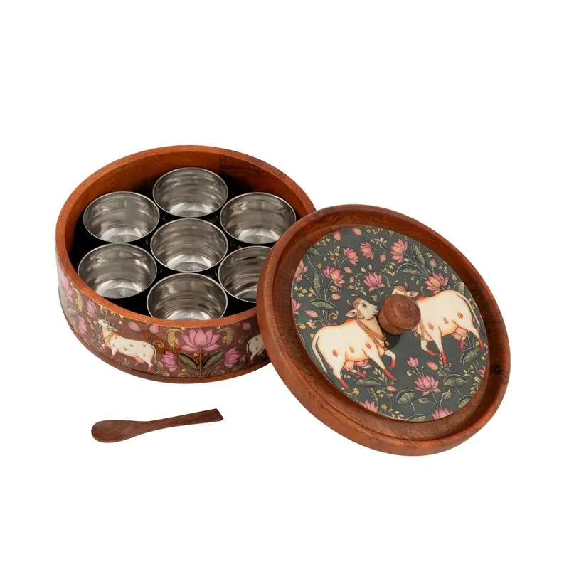 Open wooden masala box with metal-lined compartments and illustrated floral lid