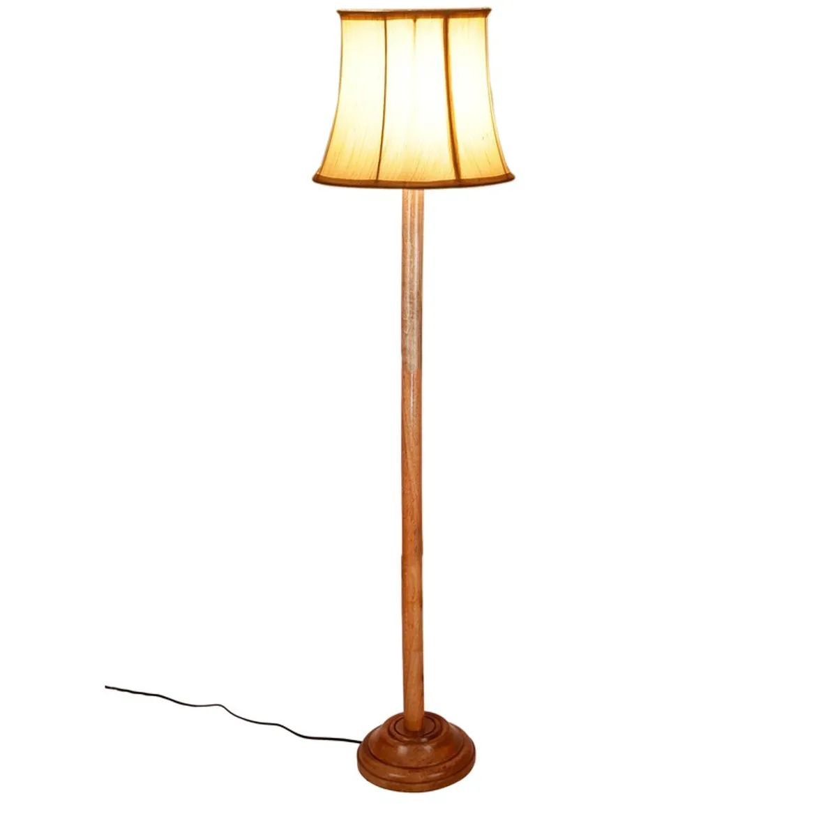 Wooden floor lamp with lit white shade on a plain white background