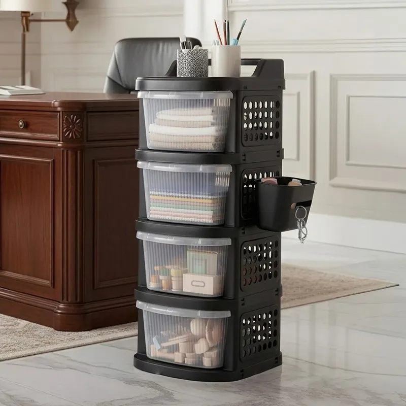 Four-tier black storage rack with transparent drawers beside a desk