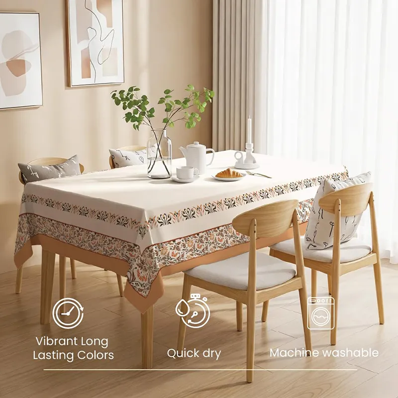Rectangular white table cover with floral border in a bright dining room
