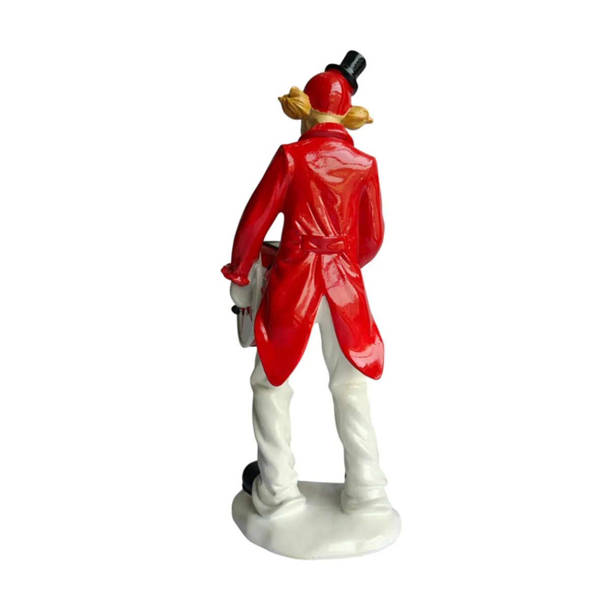 Rear view of the clown figurine showing its red costume and base
