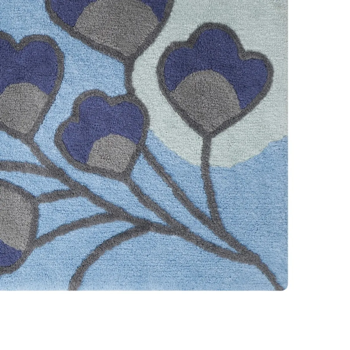 Close-up showing the textured blue, grey and pale botanical blossom design.
