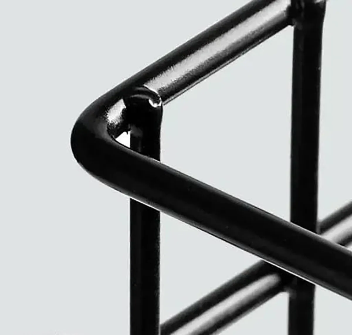 Close-up of the glossy black metal frame corner