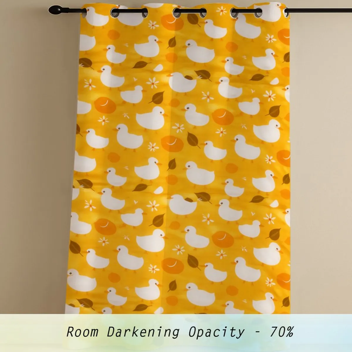 Single yellow duck print curtain panel hanging from a rod