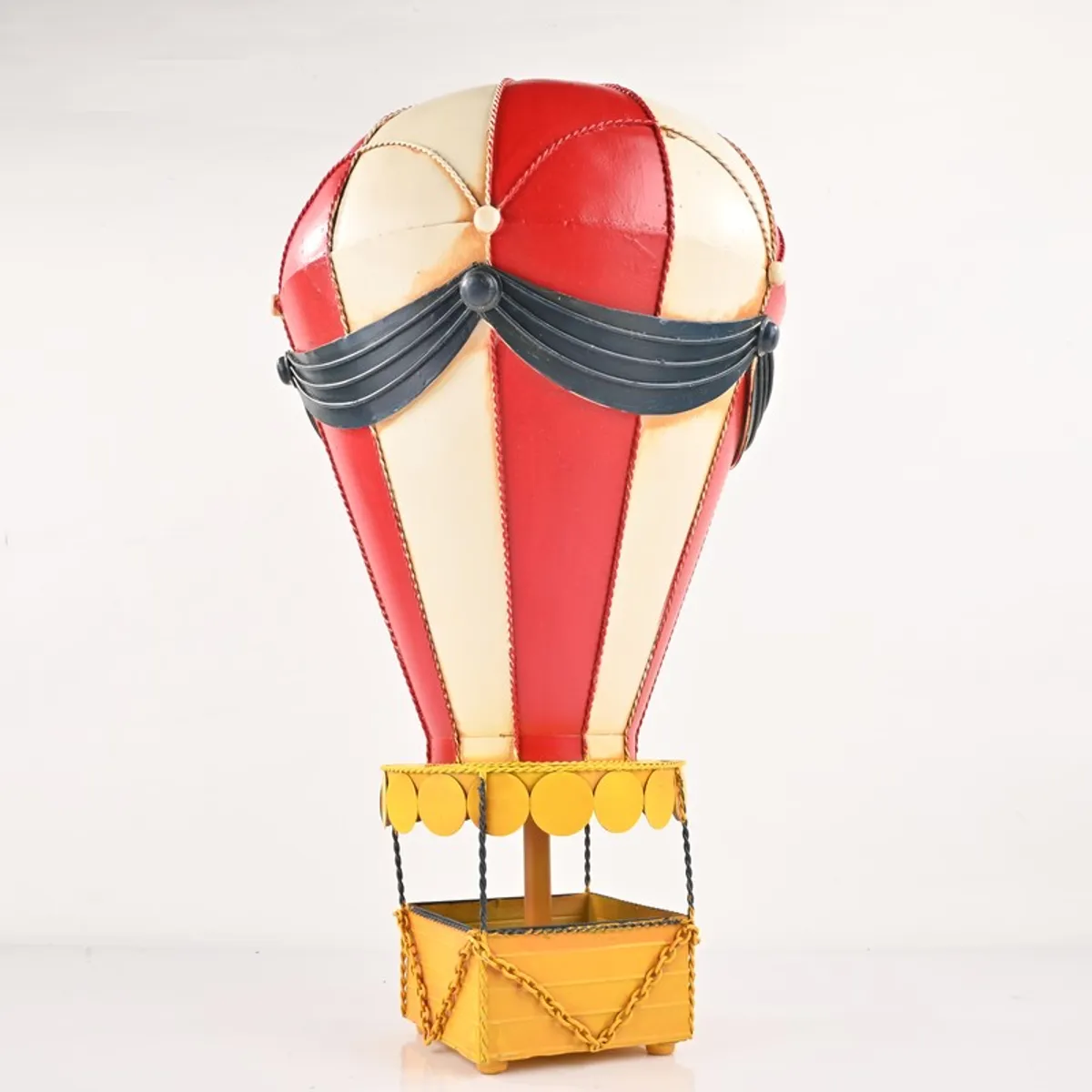 Full view of vintage-style hot air balloon showpiece on a plain background
