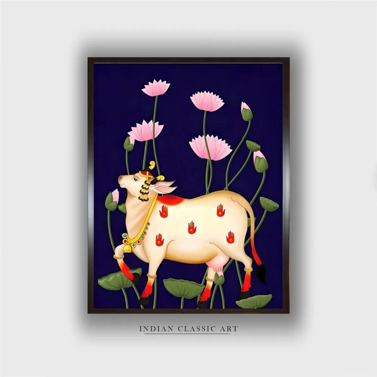 Front view of framed divine cow and lotus painting on a deep blue background