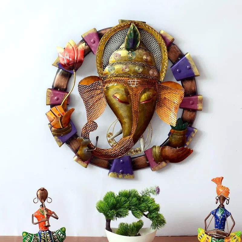Front view of decorative metal wall accent with gold, purple and orange detailing