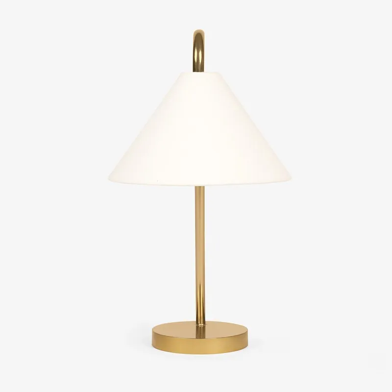Front view of white conical shade and gold table lamp