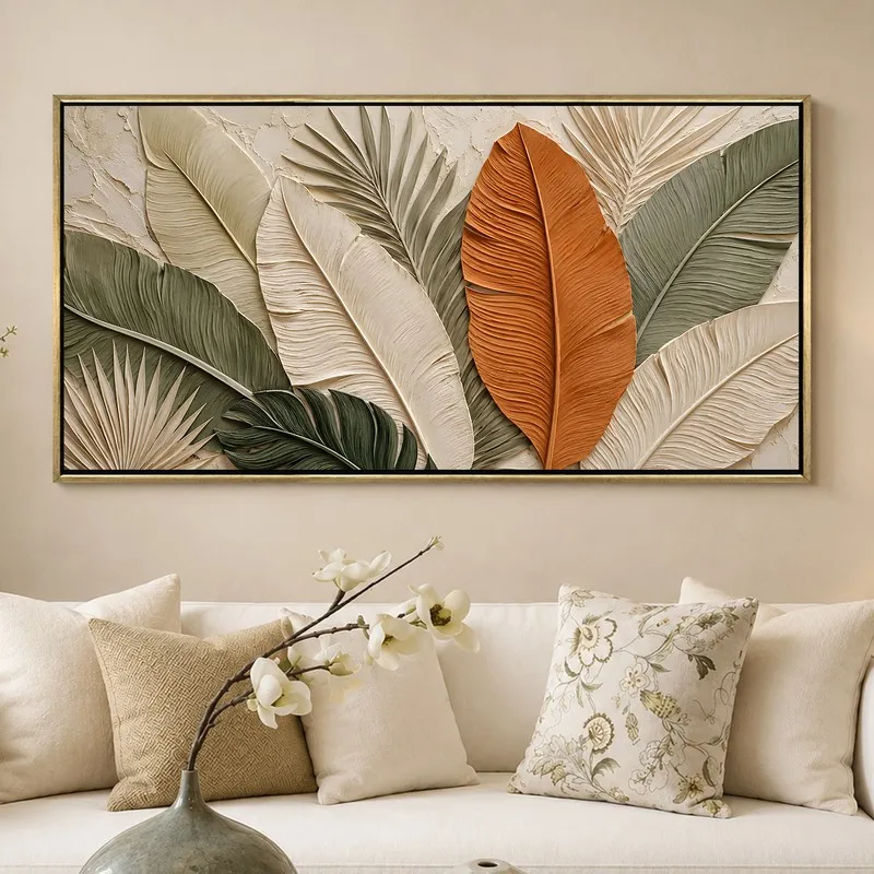 Earth-tone tropical leaf wall painting displayed above a white sofa