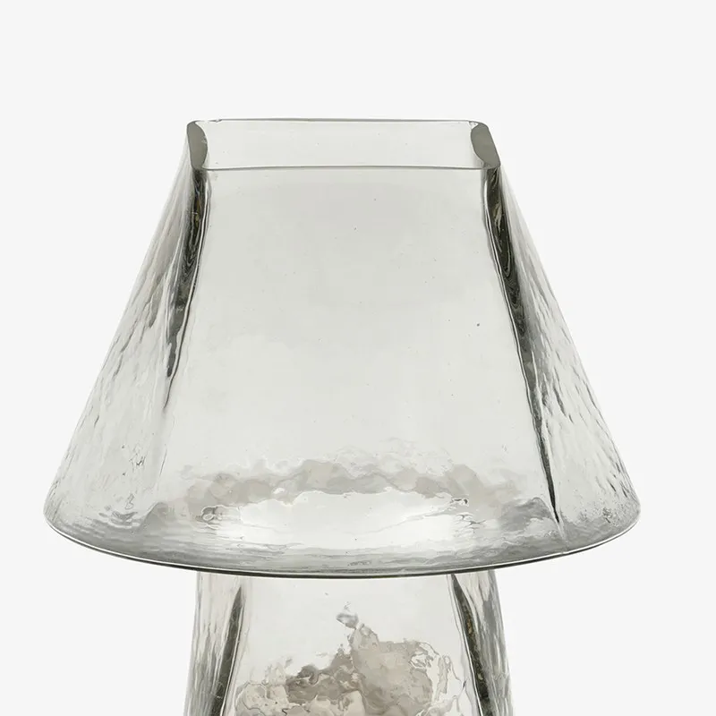 Close-up of the flared clear glass shade with textured surface
