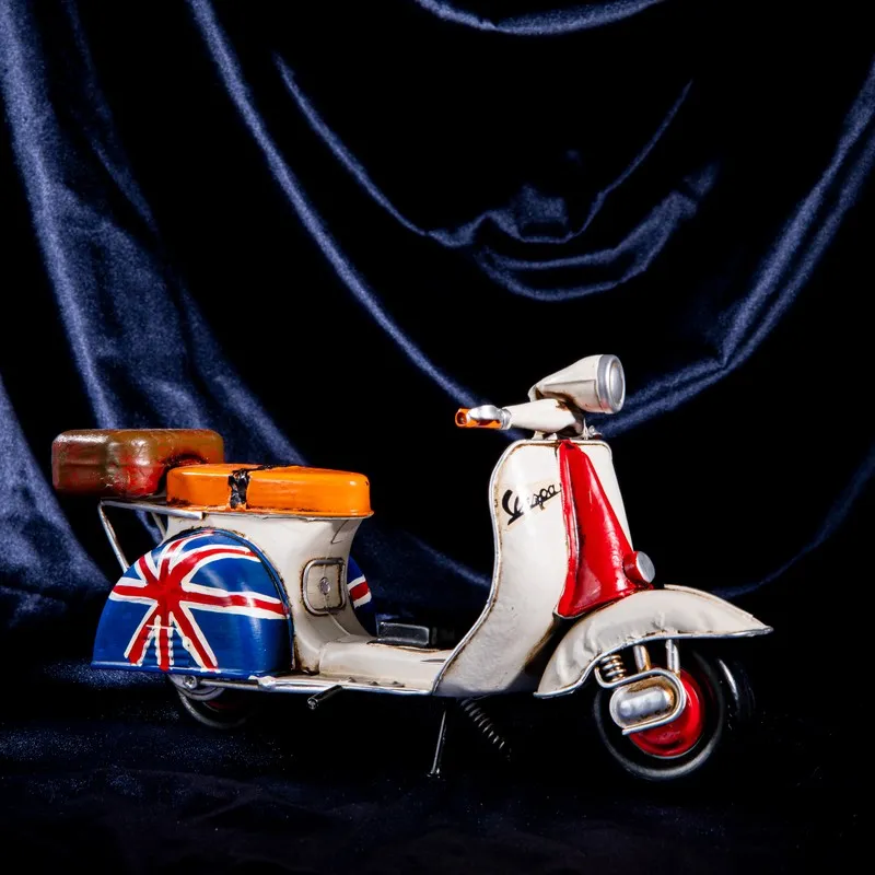 Side view of multicolour retro scooter iron showpiece
