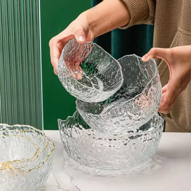 Transparent textured glass bowls shown nested together in different sizes