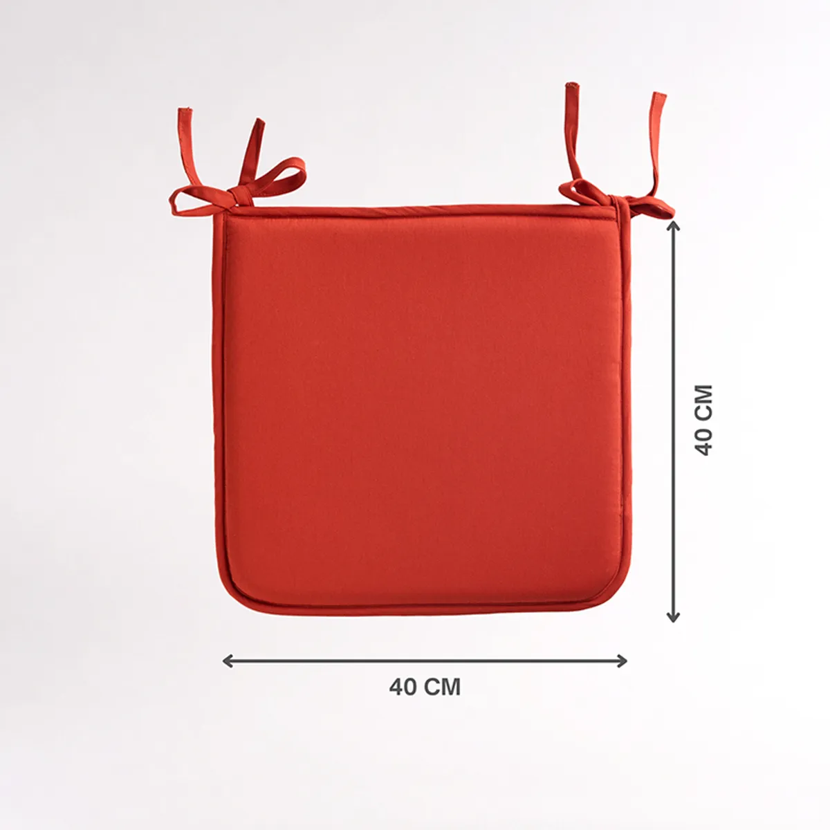 Single terracotta-brown square chair pad with corner ties