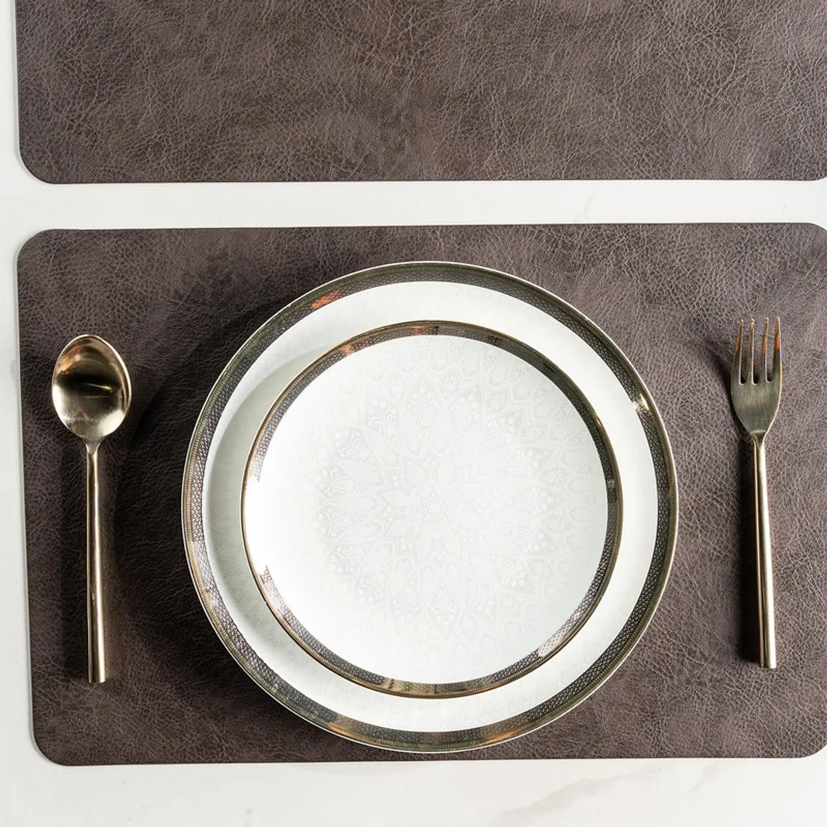 Brown textured rectangular table mat with plate, spoon and fork