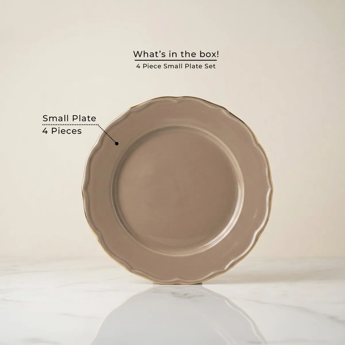 Single grey quarter plate with gold rim shown front on