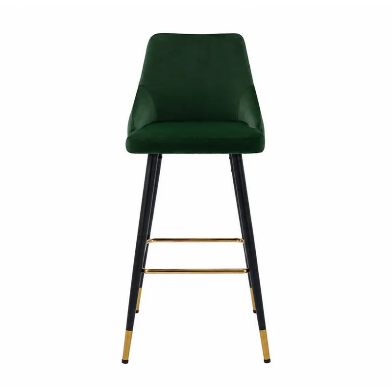 Front view of a green velvet bar chair with black legs and gold footrest