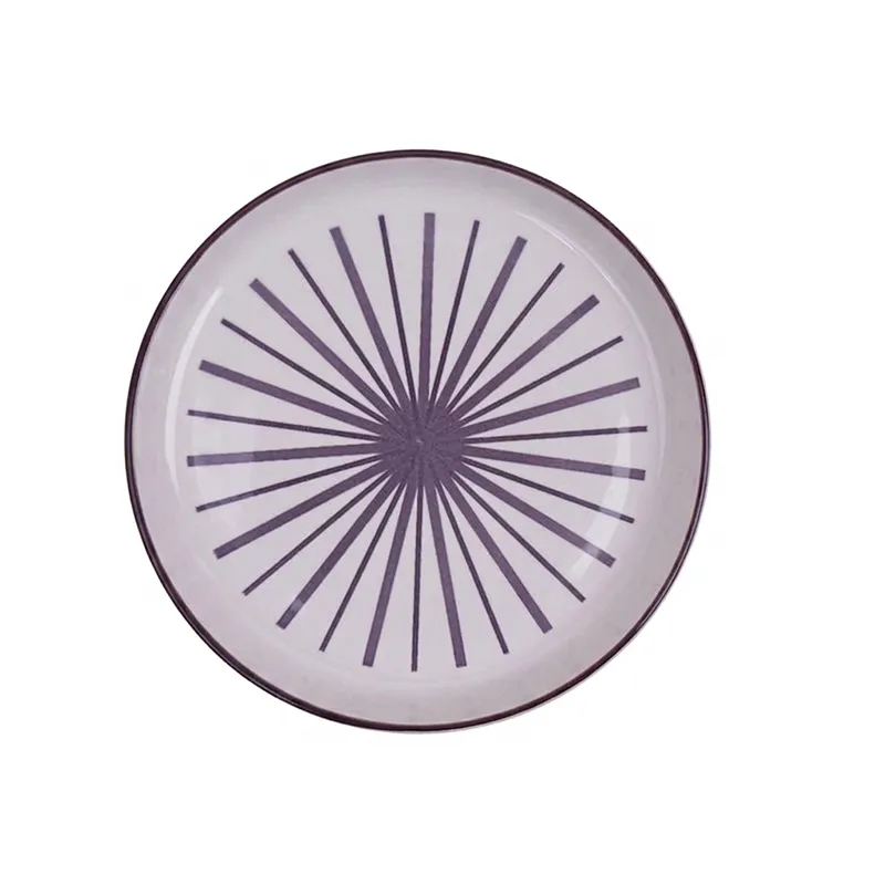 Top view of a white plate with purple starburst design