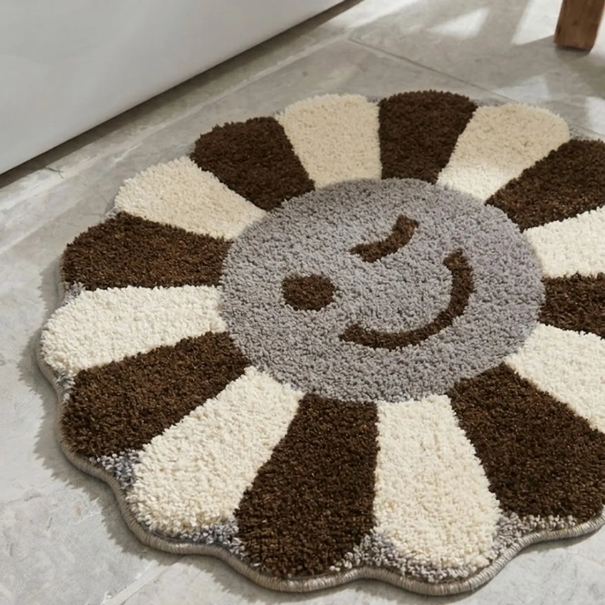 Close view of the plush brown and cream floral bath mat surface