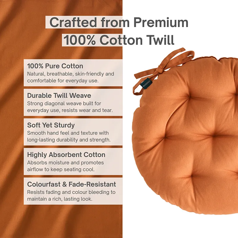 Close view of a brown round chair pad with tufted detailing and ties