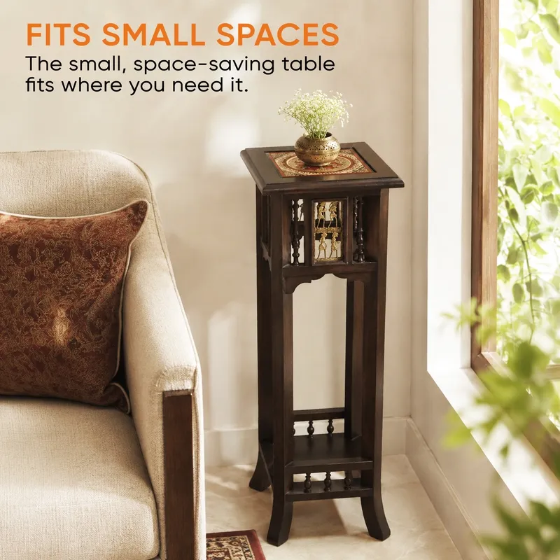 Tall narrow brown side table placed beside a sofa near a window.
