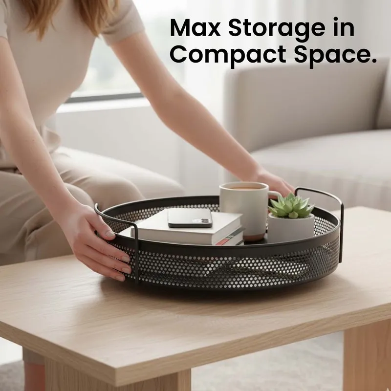Round black handled basket on a coffee table holding books and decor